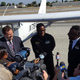 Isaiah Cooper (center), 16, of Compton, Calif., who has become the youngest black pilot to fly across the U.S.
Screenshot